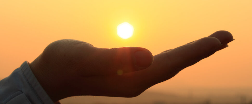 Sun in the palm of the hand for Reiki DC