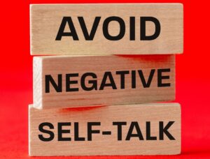 Stacked blocks saying avoid negative self-talk