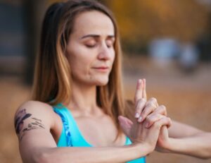 woman focused on mudra connected to herself 