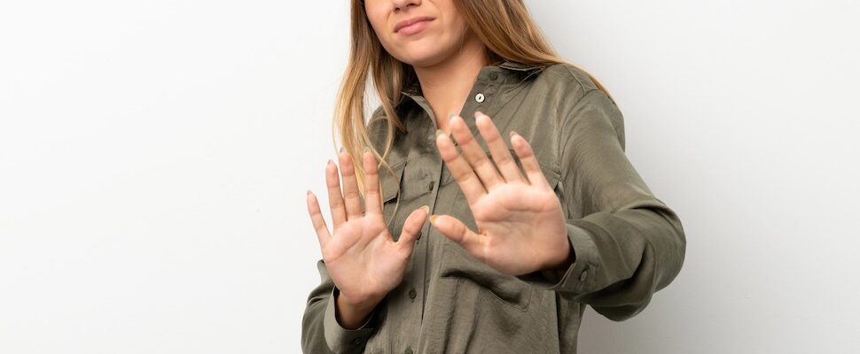 Woman hands out expressing stop for how to block energy from others